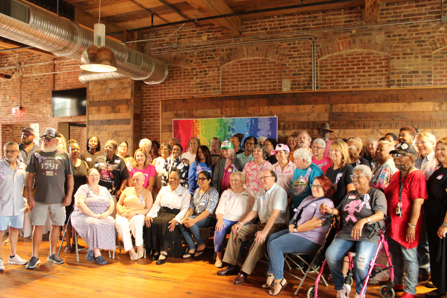 Cancer survivors pose for a group photo at the Power House event venue.