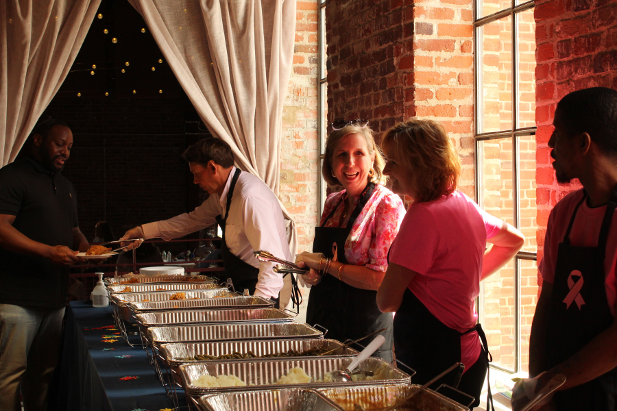 People serving lunch at Cancer Survivors Day event at the Power House.